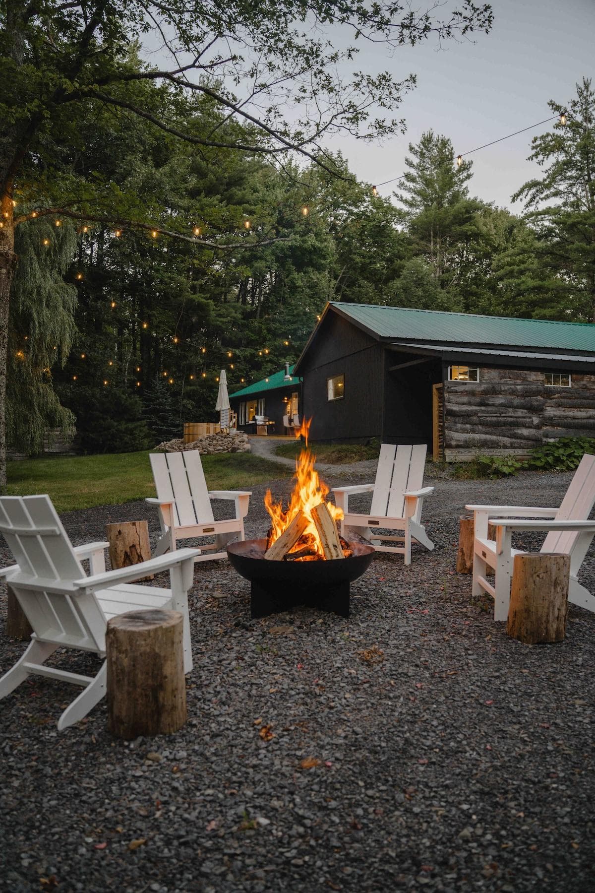 Fire pit area with Bistro lights, Adirondack chairs and Fire cauldron from CB2 

Picture by 

https://instagram.com/alexmorales____?igshid=MzRlODBiNWFlZA==